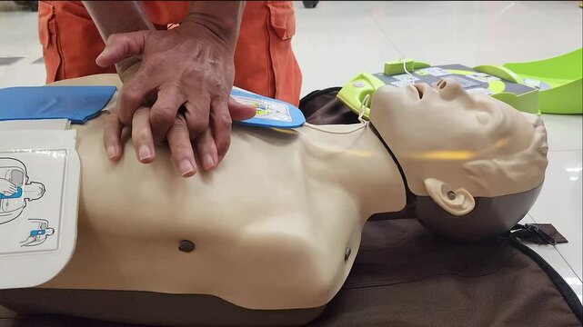 CPR practicing on the human manikin or dummy model. Medical and emergency rescue training in action, 4k footage.