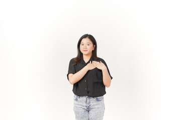beautiful Asian woman places her hand gently on her chest, expressing sincerity or gratitude, against a white background