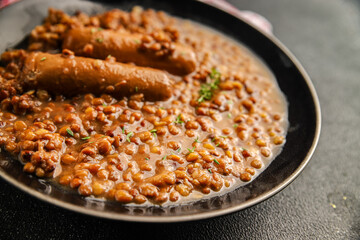 Lentil with sausages tasty food dish second course аresh delicious gourmet food background on the table rustic food top view copy space top view