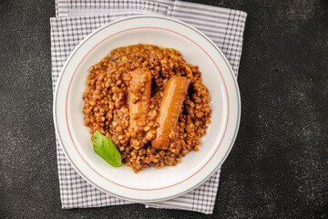 Lentil with sausages tasty food dish second course аresh delicious gourmet food background on the...