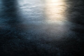 Black background with a thin white light shining from the upper left corner, creating a soft shadow of an object on one side