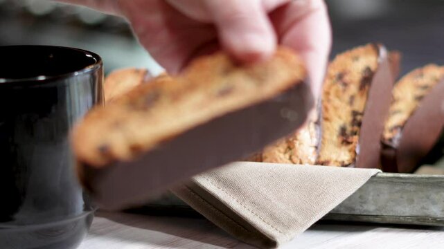  Freshly baked chocolate chip biscotti's for dunking in your favorite coffee. Homemade pastries dipped in chocolate for anytime of day but great with coffee.