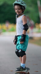 Young boy standing confidently on a skateboard, wearing protective gear and a helmet, getting ready to ride outdoors during a fun and safe playtime