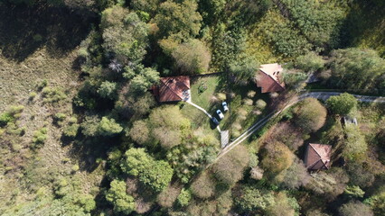 Airial view of house in the forest.