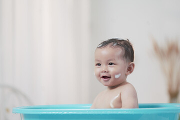 Asian children boy shower in bathroom. Funny little boy taking a bath. Infant.