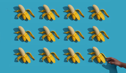 Pattern of bananas with shadows on blue surface