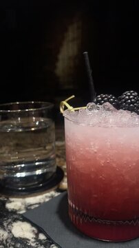 glass of a bramble cocktail