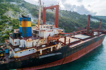 Aerial view of an abandoned bulk-carrier dry cargo ship washed ashore after a storm