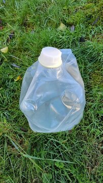 Water filled garbage on the grass
