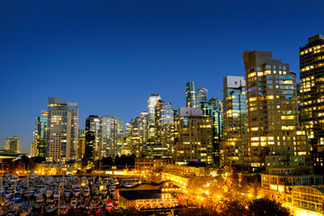 Obraz premium Vancouver British Columbia Canada City Skyline at Night Skyscraper Buildings Lights and Sky