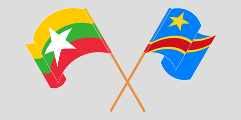 Crossed and waving flags of Myanmar and Democratic Republic of the Congo. Vector illustration
