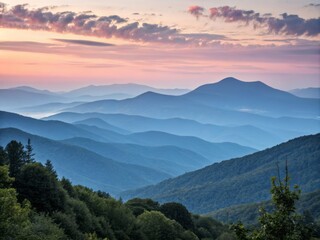 Obraz premium Soft Muted Pastel Hues of Sweeping Mountain Silhouettes Against a Serene Sky at Dusk or Dawn