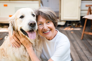 Closeup owner traveling caravanning with domestic animal pet golden retriever labrador
