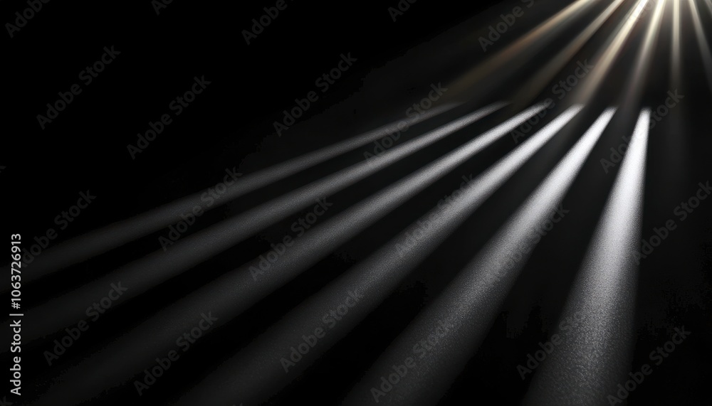 Leinwandbilder Rays of light break through darkness, creating a dramatic contrast and emphasizing texture and depth in a serene, minimalistic setting.
