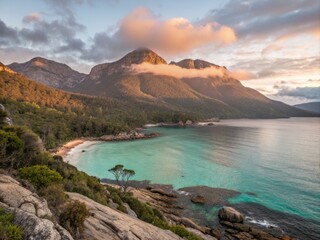 Fototapeta premium Sweeping Vistas of Serene Turquoise Tasmanian Coastline at Dawn with Gentle Waves and Soft Light