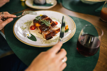 Grilled pork ribs with grilled sauce, spices, rosemary and cherry tomato.