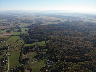 A photo of a view of a field and a road