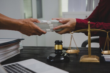 An Asian male lawyer meticulously reviews legal documents, ensuring accuracy and compliance for an upcoming court case. He highlights key points and prepares strategies to effectively