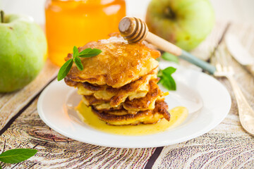 fried pancakes with apples and honey