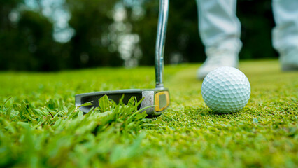 golfer playing golf in the evening golf course, on sun set evening time.