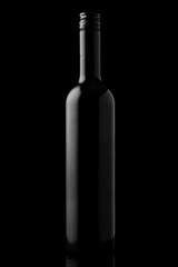 Bottle of red wine on a black reflective background, isolated on black background