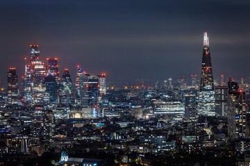 Fototapeta premium Elevated night view of the illuminated city skyline of London, England