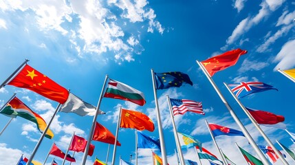 Waving Flags of Different Countries against Bright Sky with Clouds