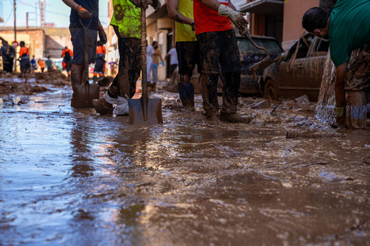 Photo shows the aftermath of the recent flood in Alfafar, Valencia, Spain. Captured are damaged homes, roads, submerged parking lots, and the efforts of residents and volunteers to clean and rebuild.