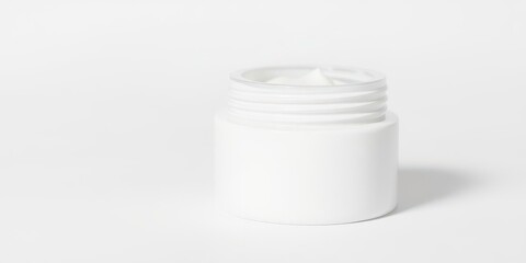 Close up of a white beauty cream container with a shiny lid, isolated on a white background, isolated, cosmetic