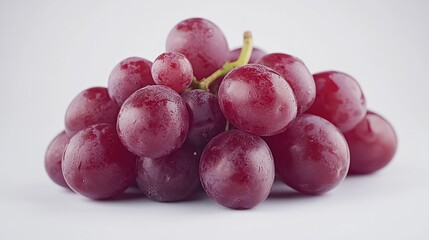 A bunch of red grapes on a white background.