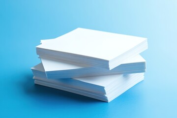 Stack of white paper sheets on blue background