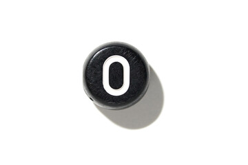 Close-up of black and white power button isolated on white background with shadow detail