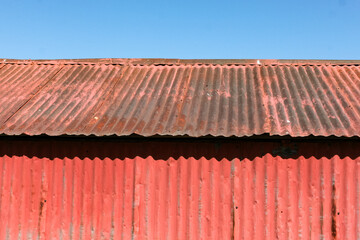 Red Building Roof and Siding made of painted corrugated metal.
