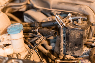 Detailed Close-Up of a Car Engine with Various Components and Hoses