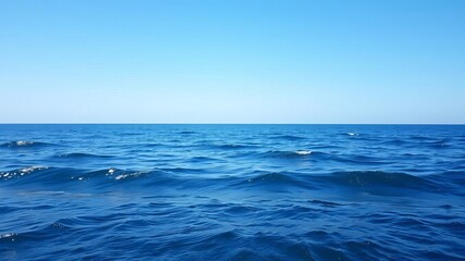 Obraz premium A serene ocean background with gentle waves and a clear blue sky, perfect for relaxation and meditation, outdoors, water