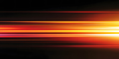 The effect of orange light in fast motion on a black background. blurred abstract background with long exposure. neon light