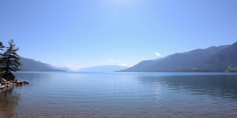 A tranquil lake reflecting the surrounding mountains on a calm sunny day, mountains, reflection