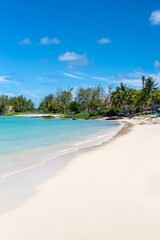 Beautiful landscape of Tropical Paradise - Belle Mare Beach stretches toward the Indian Ocean. Mauritius Island. Travel and vacation concept. 