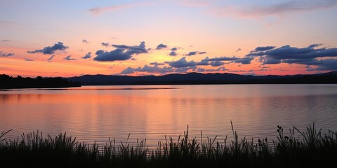 Naklejka premium A serene lakeside landscape at dusk, with pink and purple hues reflecting in the water, showcasing the beauty of the fading light, calm, landscape