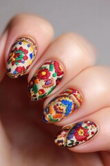 Colorful patterned nails showcase intricate floral designs, ideal for beauty blogs, nail art tutorials, and fashion magazines targeting creative audiences, Capture the essence of artistic nail styles