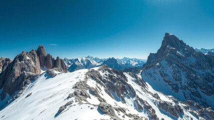 A majestic snow-capped mountain range standing tall, snow, outdoors