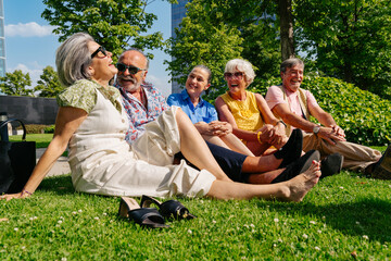 Group of senior friends meeting outdoors in the city and having fun - Cheerful old people bonding together, concepts about elderly, quality of life and aging lifestyle