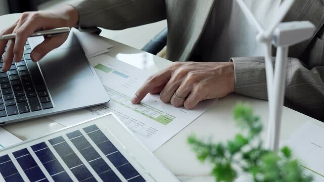 Business eco Alternative, sustainable electricity, people creating ideas working on green energy in eco friendly office