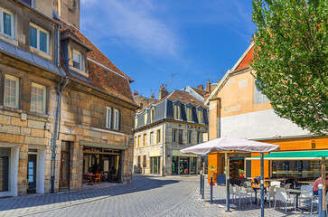 Small square in Besancon old town centre ville with old houses, medieval buildings, street restaurants and cafes, La boucle de Besançon city historic centre, Bourgogne-Franche-Comte region, France