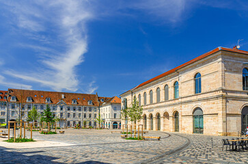 Place de la Revolution square, Museum of Fine Arts and Archeology building and green trees in Besancon old town centre ville, Besançon city historic centre, Bourgogne-Franche-Comte region, France