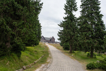The mountain shelter atop Szrenica peak in the Karkonosze offers a cozy retreat with stunning alpine views
