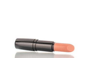 One cosmetic lipstick, macro, isolated on white background.
