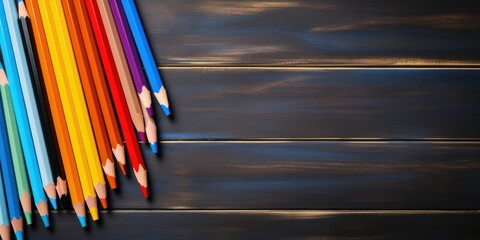 A collection of sharpened colorful pencils arranged on a dark wooden surface, with a minimalist aesthetic and a sense of anticipation for creativity.