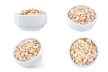 Raw dried oats in a bowl on a white isolated background