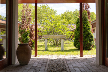 Inner courtyard of an ancient Roman villa with an old stone domestic altar